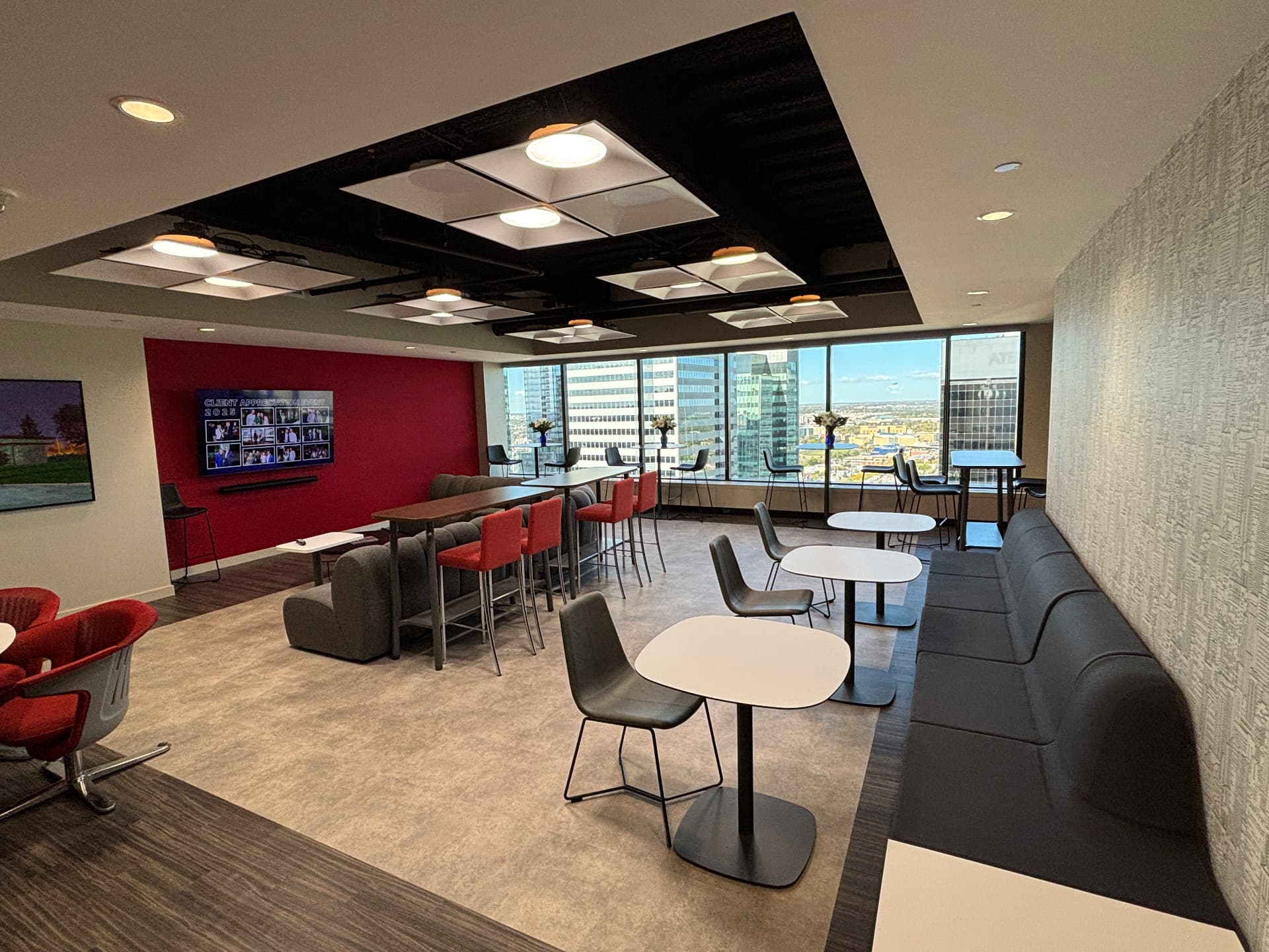 Open team lounge on the 27th floor of TD Tower with seating and views of downtown Edmonton