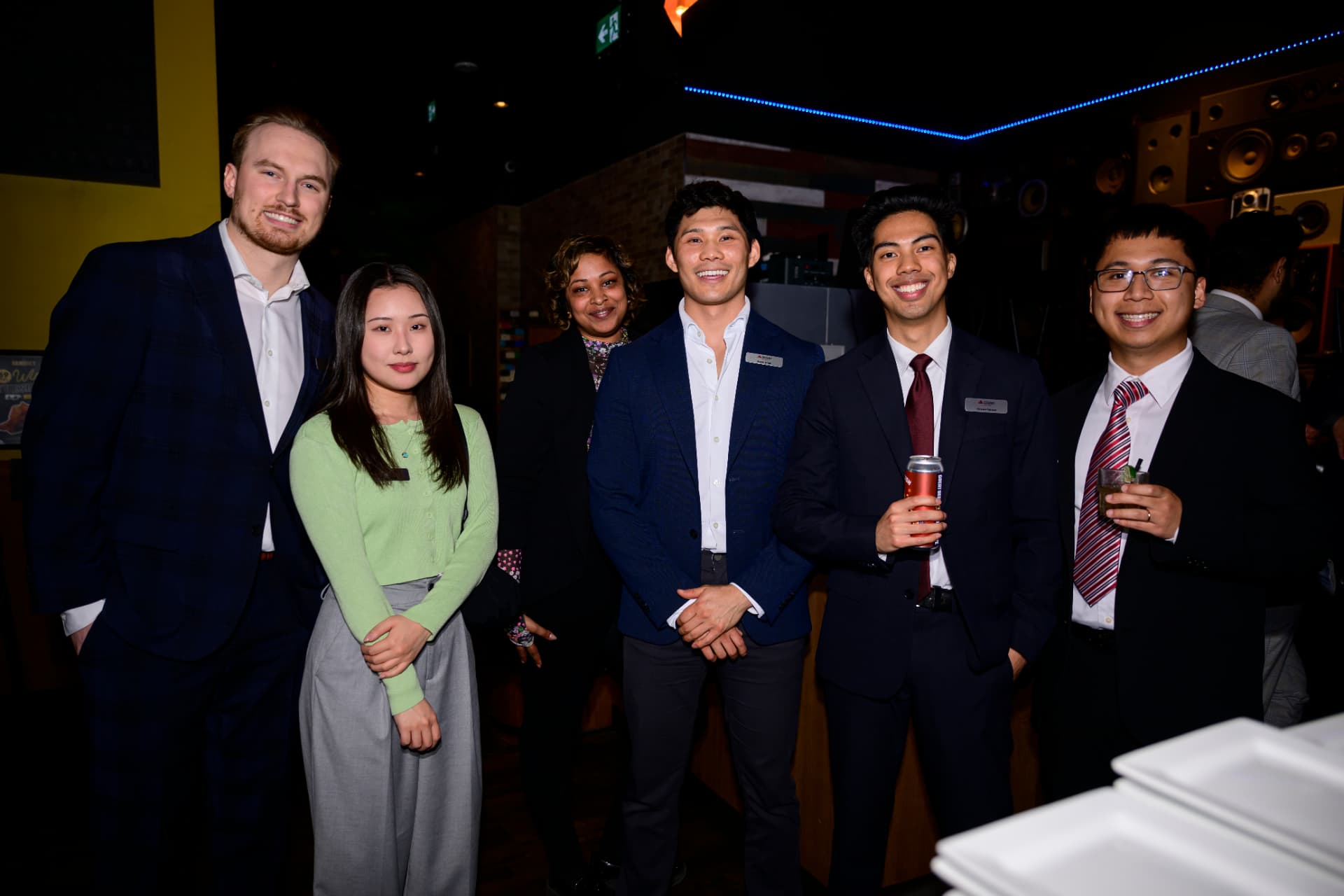 Six Cushman & Wakefield Edmonton colleagues together at an evening event