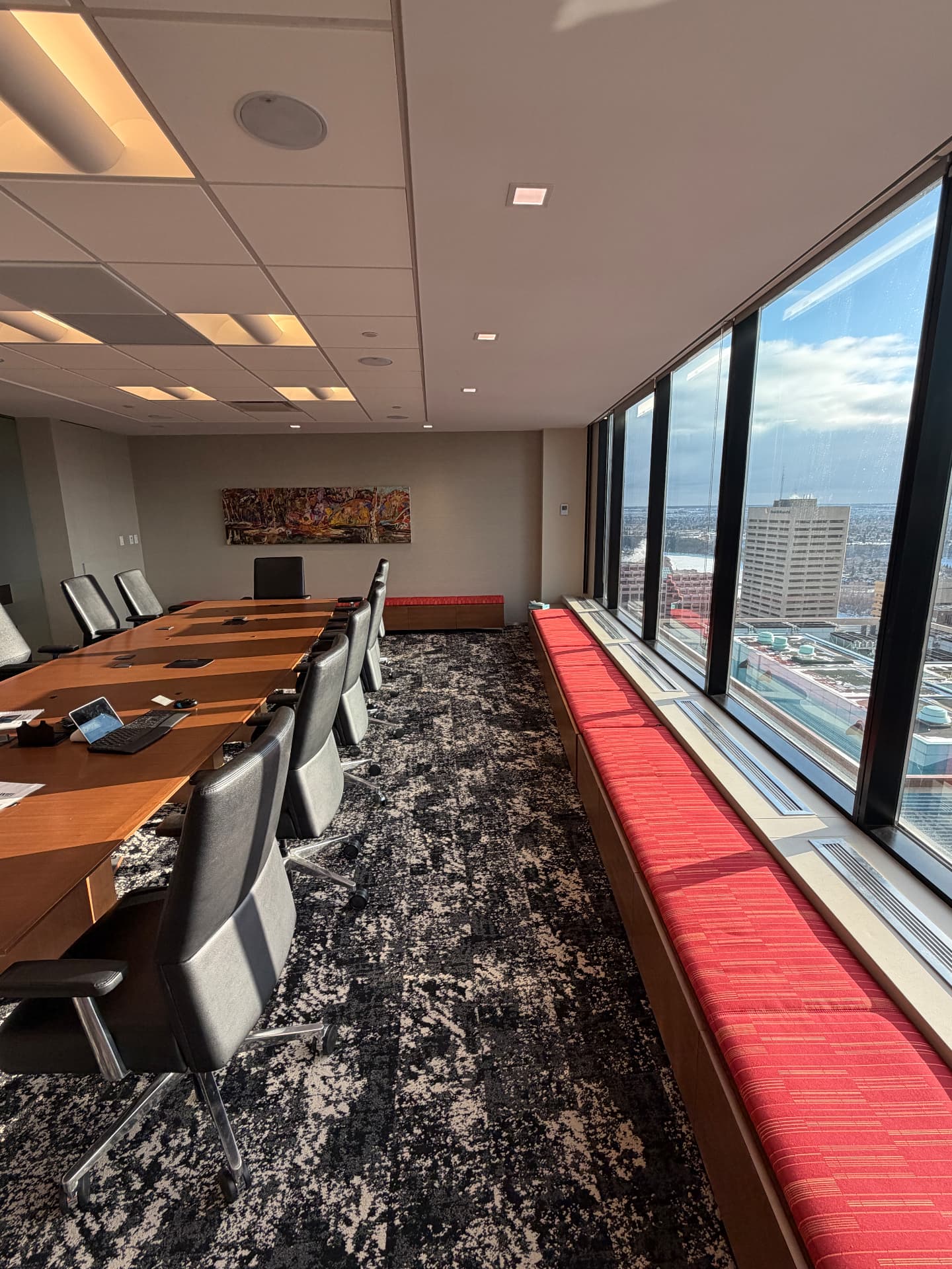Large boardroom on the 27th floor of TD Tower with floor-to-ceiling windows overlooking Edmonton